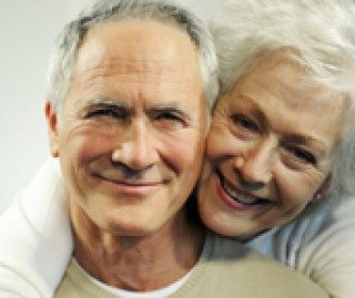 senior couple smiling in photo with white teeth